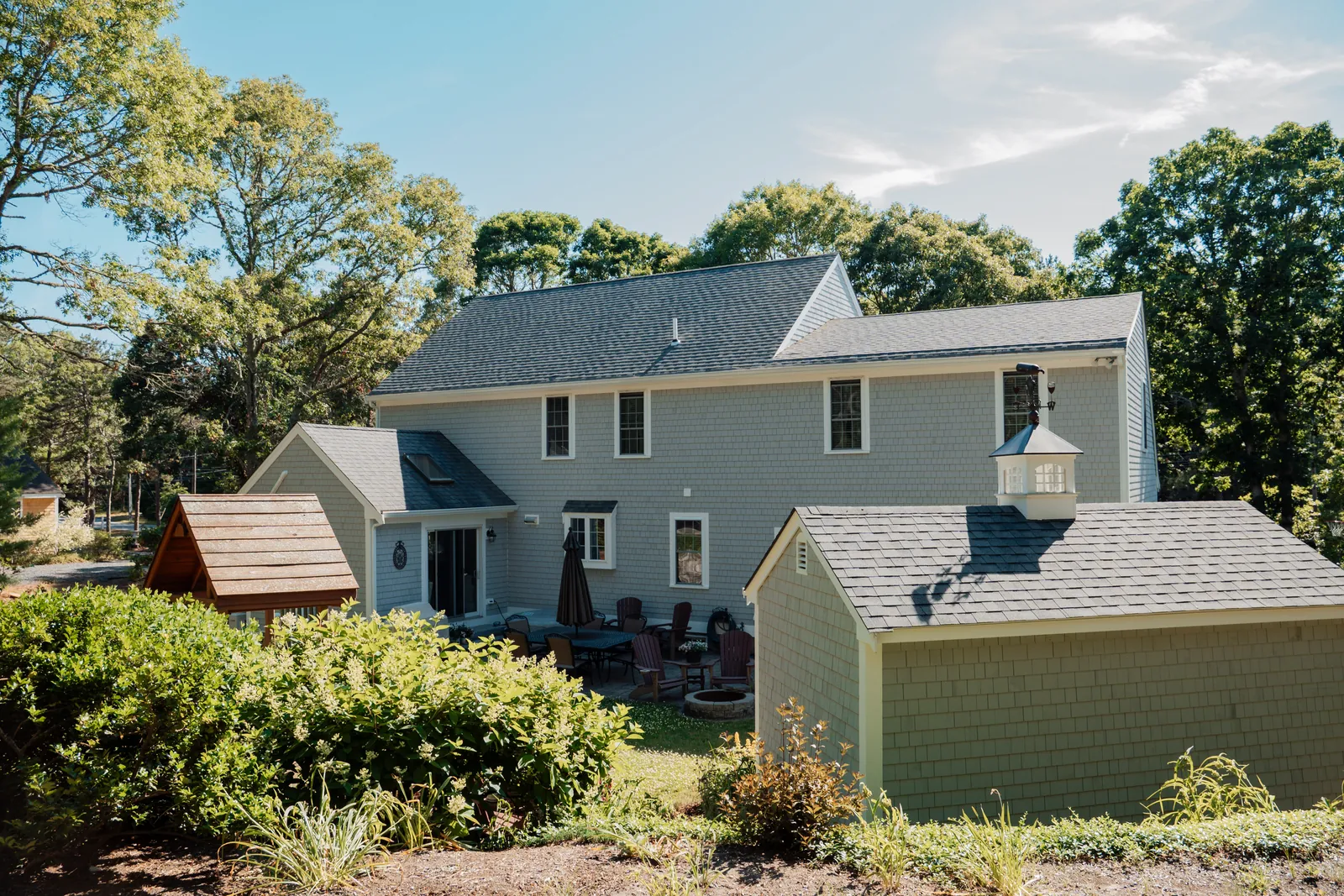 Cape Cod home with new siding and deck by USA Fast Solution